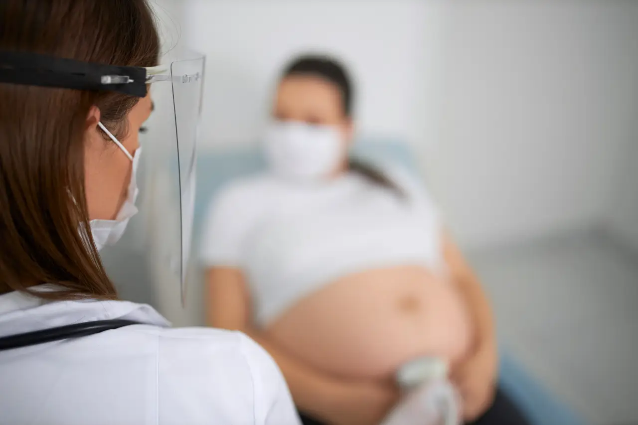 doctor-mask-doing-ultrasound-checkup-pregnant-woman